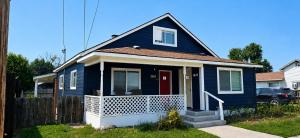 a blue house with a red door at Grove Street Couplet #2 in Baker City