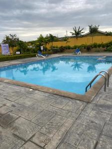 a large swimming pool with blue water at Winslow Place in Falmouth