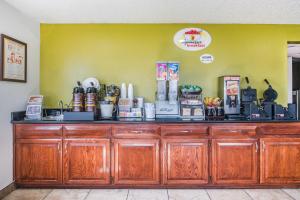 a counter in a coffee shop with a counter top at Super 8 by Wyndham Harlingen TX in Harlingen