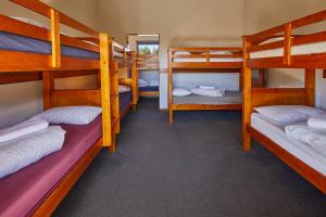 a group of bunk beds in a room at Glentanner Park Centre in Glentanner