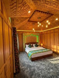 a bedroom with a bed in a wooden room at Luxury Egypt Group of House Boat in Srinagar