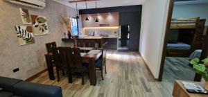 a kitchen and dining room with a table and chairs at Cabañas MI REFUGIO TERMAL in Roboré +13 photos