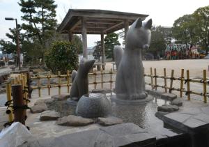 a statue of a dog and a horse in a fountain at Super Hotel Yamaguchi Yuda Onsen in Yamaguchi +88 photos