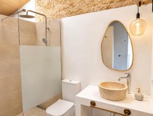 a bathroom with a sink and a mirror at Can Roig in Ses Salines +12 photos