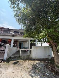 a white fence in front of a house with a tree at Stellas house in Langkawi Islands