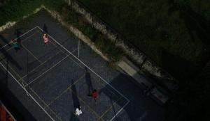 an overhead view of people walking on a tennis court at Villas NEST Athirappilly in Athirappilly