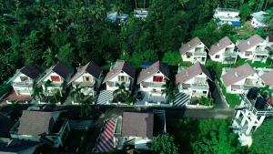 an overhead view of a group of houses with roofs at Villas NEST Athirappilly in Athirappilly +6 photos