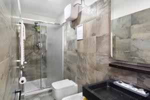 a bathroom with a shower and a toilet and a sink at Villa Fuenti Bay - Amalfi Coast in Cetara +18 photos