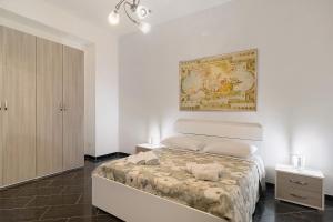 a bedroom with a bed and a painting on the wall at Tre Corone - Sarno in Sarno