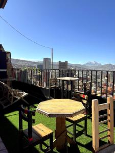 a table and chairs on top of a roof at Hotel Berlina in La Paz
