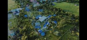 an aerial view of a house with trees at Churinga Eco Resort in Tigaon