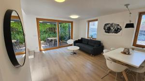 a living room with a couch and a table at Rezidence Pavlov in Pavlov