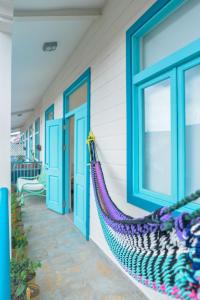 a hammock hanging on the side of a house at Bocas Style in Casco Viejo in Panama City