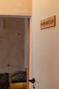 a sign on the door of a room with a market sign on it at Boutique Hotel Verne Dreams in Ghent