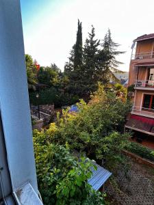 a garden with a bench in front of a building at Reflection of the Bosphorus in Istanbul