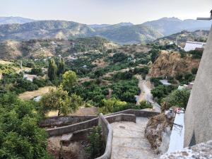 a view from the top of a mountain at La Muralla in Yunquera
