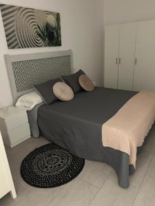 a bedroom with a large bed in a room at Austria 03 in Lebrija
