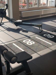 a gym with a bench and a speed limit at ALPURA Allgäu - Active Nature Retreat - HOTEL REOPENING in Bad Hindelang