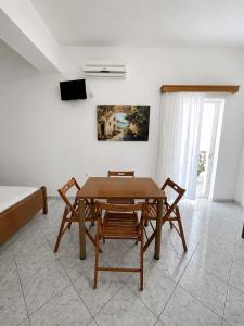 a dining room with a table and two chairs at Sunset Studios in Borsh