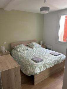 a bedroom with a bed and a window at Nandys lounge in Yaoundé