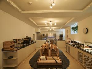 a large room with a kitchen with a table at Carlton Boutique Hotel - NEW OPENING in Vienna