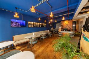 a restaurant with blue walls and tables and chairs at Redmont Hotel Nisantasi in Istanbul