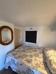a bedroom with a bed and a flat screen tv at Bordagorria 