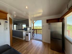 a kitchen and living room with a view of a balcony at Bordagorria 
