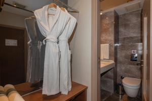 a bathroom with a towel hanging on a rack at Redmont Hotel Nisantasi in Istanbul +47 photos