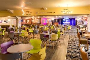 a restaurant with tables and chairs in a room at 3 bed static van with decking in Dymchurch