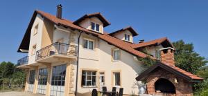 a large white house with a brick at Garden Haus Livno in Livno