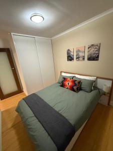 a bedroom with a large bed with two pillows at Yokomokko House in Bridgewater