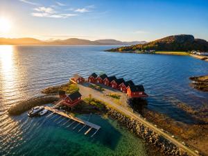 an aerial view of a resort on an island in the water at Rønsholmen brygger in Beian