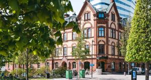 an old brick building in a city at Stora Hotellet; BW Premier Collection in Umeå