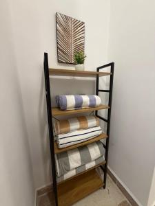 a towel rack with towels on it next to a wall at Bajareque Oceanfront Luxury 3 BR Villa in Telchac Puerto +23 photos