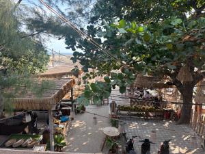 an overhead view of an outdoor market with a tree at My happy place loft gili air in Gili Islands