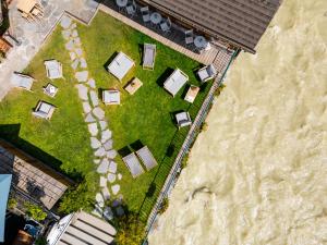 an overhead view of a yard with tables and chairs at Hôtel de L'Arve by HappyCulture in Chamonix +68 photos