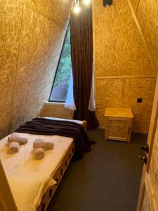 a small room with two beds and a window at Hayrapet Asatryan in Arzakan