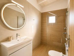 a bathroom with a sink and a mirror at Dolphin hotel in Korfos