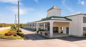 a large white building with a street in front of it at Rodeway Inn & Suites in Lakeview