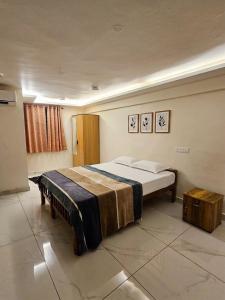 a bedroom with a large bed in a room at Tvm stays in Trivandrum