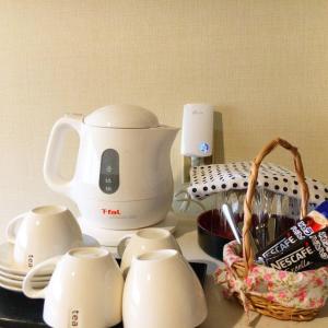 a counter top with a coffee maker and tea cups at ARASHIMA INN 201 / Vacation STAY 162 in Toba