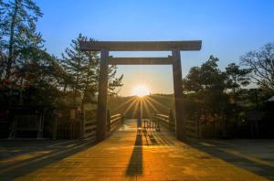 a torii gate with the sunset in the background at ARASHIMA INN 201 / Vacation STAY 162 in Toba