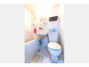 a bathroom with a toilet and a sink at Private House Sora / Vacation STAY 1122 in Sakai