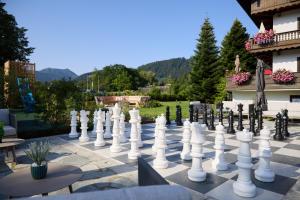 a giant chessboard on the patio of a building at Hotel Alpenhof in Bad Wiessee