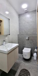 a bathroom with a sink and a toilet at Maftun Guest House in Samarkand
