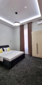 a bedroom with a large bed in a room at Maftun Guest House in Samarkand