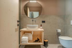 a bathroom with a sink and a mirror at Agriturismo Maso Loera in Pelugo +33 photos