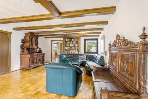 a living room with a couch and a table at Fewo Wrede am Sauerland-Radring 1 in Wenholthausen