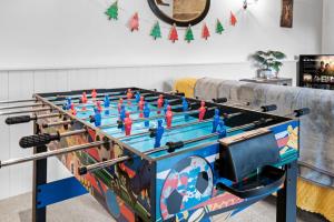 a ping pong table in a living room at Traditional Cotswold escape with garden and fireplace in Cheltenham